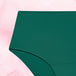 High Waist Lite Mens Menstruse vises mot en rosa bakgrunn.