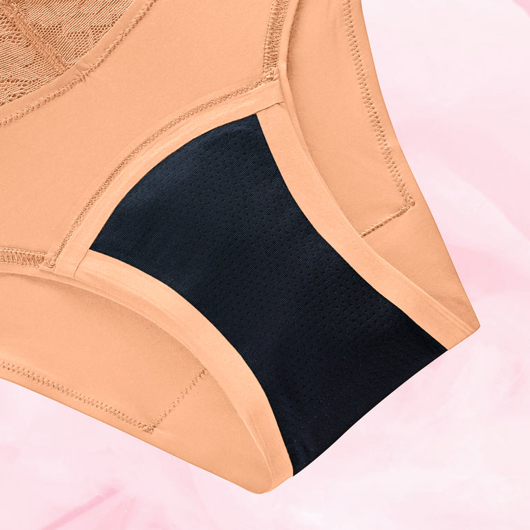 Brazilian Lite Menstruse, beige med svart gusset, nærbilde.